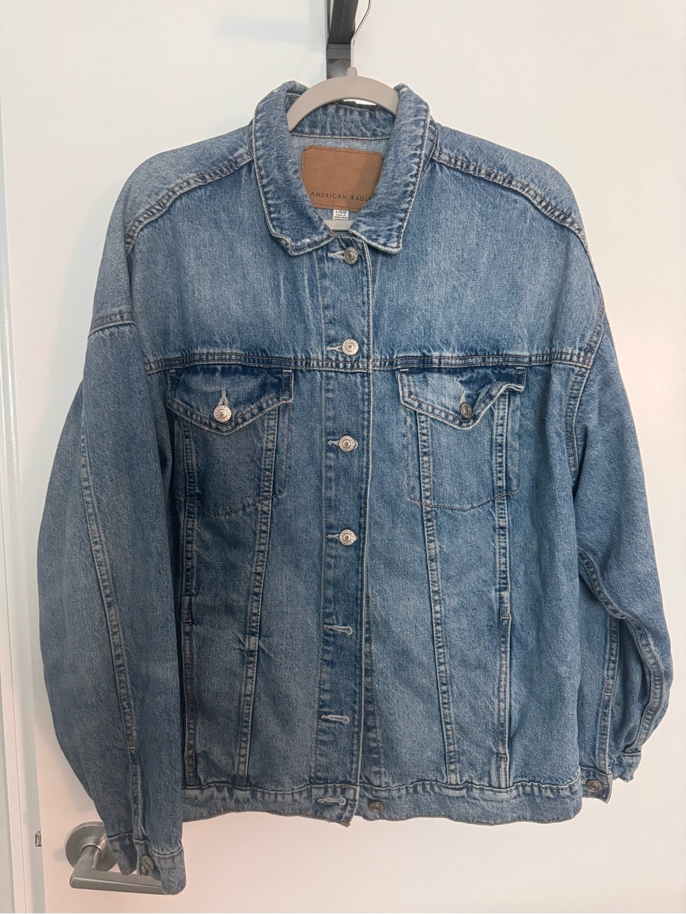 American Eagle Outfitters Light Blue Denim Jacket with Brown Leather Patch